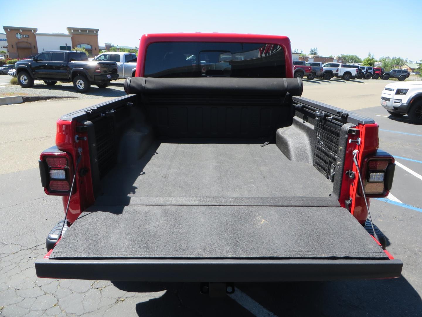 2020 Red /black Jeep Gladiator Rubicon (1C6JJTBG6LL) with an 3.6L V6 DOHC 24V engine, 6M transmission, located at 2630 Grass Valley Highway, Auburn, CA, 95603, (530) 508-5100, 38.937893, -121.095482 - Rubicon Gladiator featuring a Mopar suspension system with Fox shocks, 17" AEV wheels wrapped in 37" BFG tires, Warn Winch, Rock sliders, Cascade front license plate holder, Impact bedliner, Built Right Industries bed Molle panels, and Window tint. - Photo#13